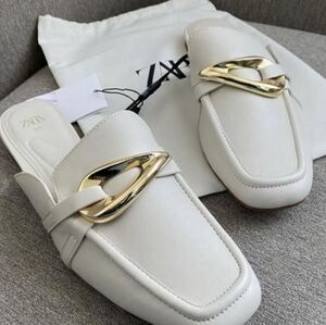 Stylish White Loafers with Gold and Silver Accents